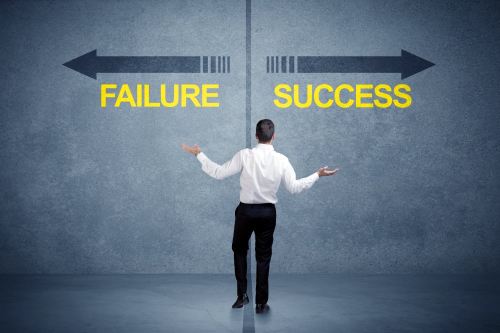 Businessman standing in front of success and failure arrow concept on grungy background