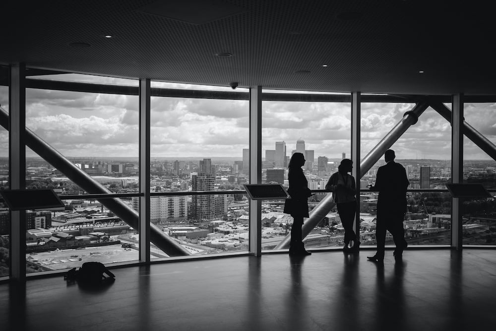 People looking out from a skyscraper